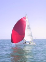 Here's PLANET B on saturday, practicing their technique downwind in light airs.